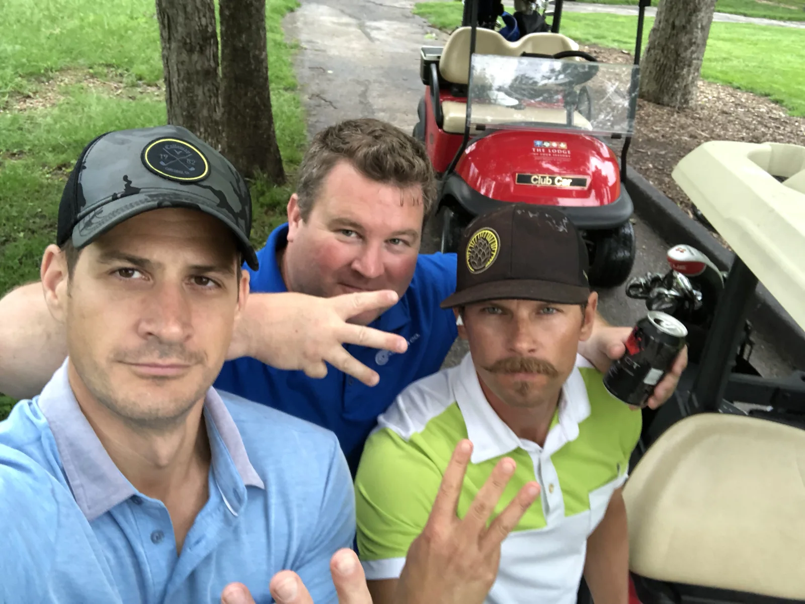Friends taking a selfie in a golf cart