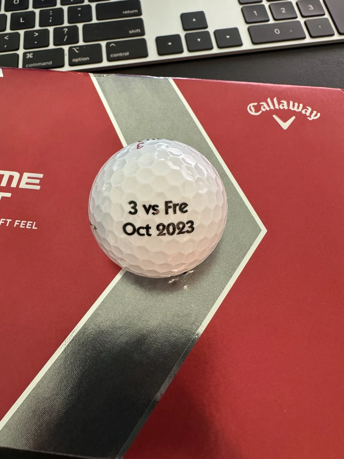 Custom 3 vs. Fre golf balls in their packaging